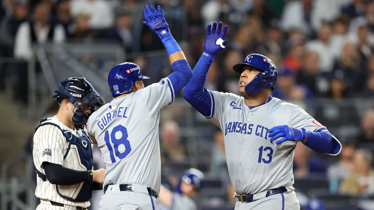 NEW YORK, NEW YORK - OCTOBER 07: Salvador Perez #13 of the Kansas City Royals celebrates with Yuli Gurriel #18 after hitting a solo home run in the fourth inning against the New York Yankees during Game Two of the Division Series at Yankee Stadium on October 07, 2024 in New York City.