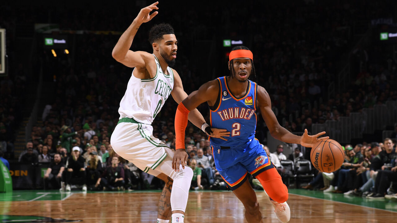 BOSTON, MA - NOVEMBER 14: Shai Gilgeous-Alexander #2 of the Oklahoma City Thunder dribbles the ball during the game against the Boston Celtics, Jayson Tatum #0 of the Boston Celtics plays defense on November 14, 2022 at the TD Garden in Boston, Massachusetts. Mandatory Copyright Notice: Copyright 2022 NBAE