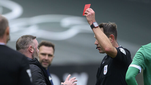 PLYMOUTH, ENGLAND - OCTOBER 5: Plymouth Argyle manager Wayne Rooney is shown a red card by referee James Linington during the Sky Bet Championship match between Plymouth Argyle FC and Blackburn Rovers FC at Home Park on October 5, 2024 in Plymouth, England.
