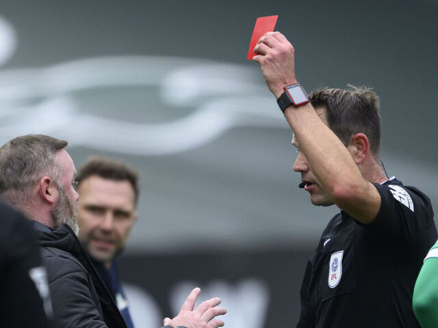 PLYMOUTH, ENGLAND - OCTOBER 5: Plymouth Argyle manager Wayne Rooney is shown a red card by referee James Linington during the Sky Bet Championship match between Plymouth Argyle FC and Blackburn Rovers FC at Home Park on October 5, 2024 in Plymouth, England.