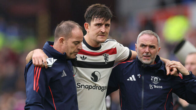 BIRMINGHAM, ENGLAND - OCTOBER 06: An injured Harry Maguire of Manchester United is helped off during the Premier League match between Aston Villa FC and Manchester United FC at Villa Park on October 06, 2024 in Birmingham, England.