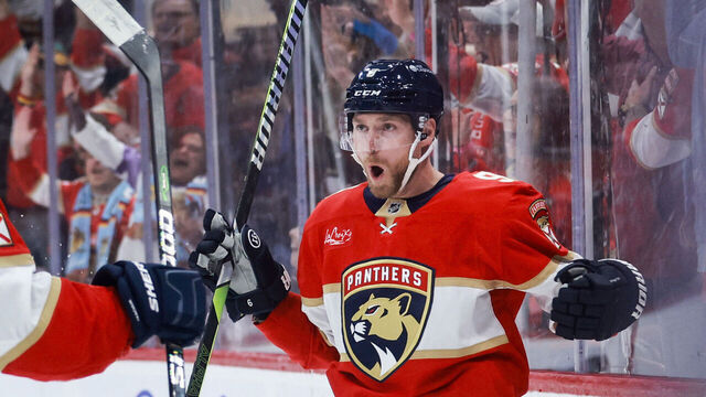 SUNRISE, FLORIDA - OCTOBER 08: Sam Bennett #9 of the Florida Panthers reacts with Matthew Tkachuk #19 after scoring a goal during the first period against the Boston Bruins. at Amerant Bank Arena on October 08, 2024 in Sunrise, Florida.