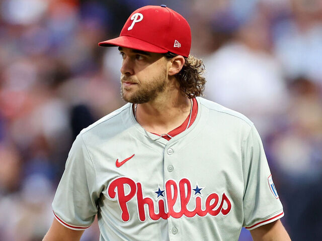 NEW YORK, NEW YORK - OCTOBER 08: Aaron Nola #27 of the Philadelphia Phillies reacts in the third inning against the New York Mets during Game Three of the Division Series at Citi Field on October 08, 2024 in New York City.