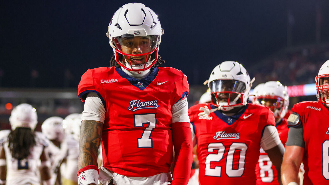 LYNCHBURG, VIRGINIA - OCTOBER 08: Kaidon Salter #7 of the Liberty Flames reacts after scoring a touchdown during the first half of a football game against the Florida International University Panthers at Williams Stadium on October 08, 2024 in Lynchburg, Virginia.