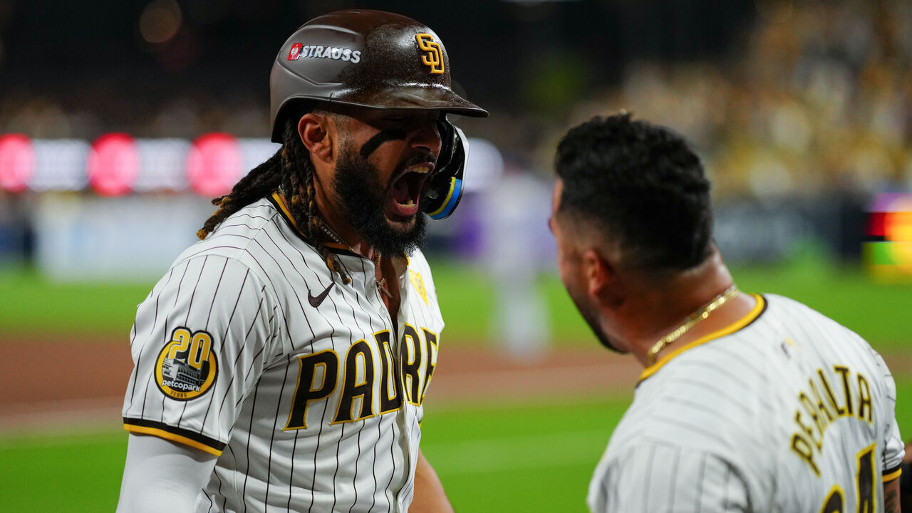 SAN DIEGO, CA - OCTOBER 08: Fernando Tatis Jr. #23 of the San Diego Padres celebrates with David Peralta #24 after hitting a two-run home run in the second inning during Game 3 of the Division Series presented by Booking.com between the Los Angeles Dodgers and the San Diego Padres at Petco Park on Tuesday, October 8, 2024 in San Diego, California.