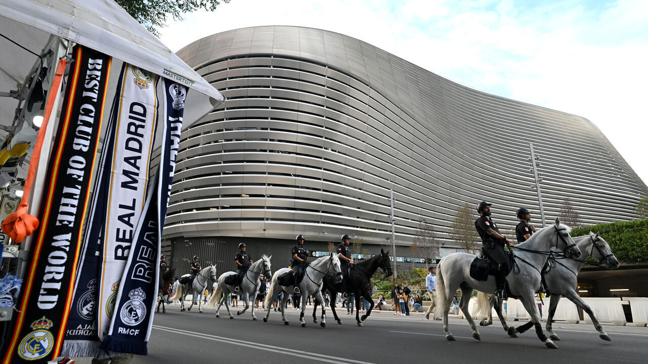 MADRID, SPAIN - SEPTEMBER 24: General view outside the stadium, Merchandise is seen for sale outside the stadium, as mounted police are seen prior to the LaLiga match between Real Madrid CF and Deportivo Alaves at Estadio Santiago Bernabeu on September 24, 2024 in Madrid, Spain.