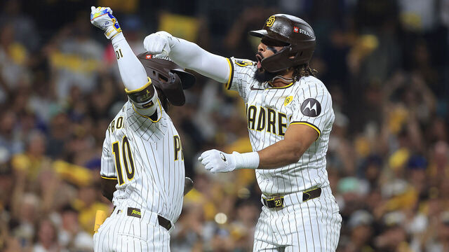 SAN DIEGO, CALIFORNIA - OCTOBER 08: Jurickson Profar #10 and Fernando Tatis Jr. #23 of the San Diego Padres celebrate after Tatis Jr. hit a home run in the second inning against the Los Angeles Dodgers during Game Three of the Division Series at Petco Park on October 08, 2024 in San Diego, California.