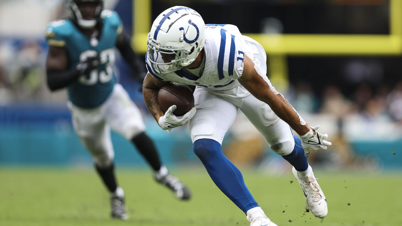 JACKSONVILLE, FLORIDA - OCTOBER 06: Michael Pittman Jr. #11 of the Indianapolis Colts runs with the ball during an NFL football game against the Jacksonville Jaguars at EverBank Stadium on October 6, 2024 in Jacksonville, Florida.