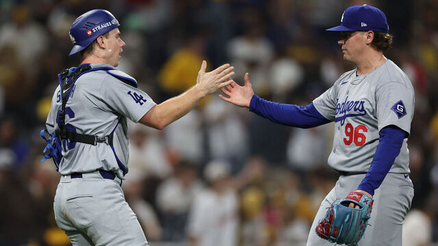 SAN DIEGO, CALIFORNIA - OCTOBER 09: (L-R) Will Smith #16 and Landon Knack #96 of the Los Angeles Dodgers celebrate a 8-0 win against the San Diego Padres in Game Four of the Division Series at Petco Park on October 09, 2024 in San Diego, California.