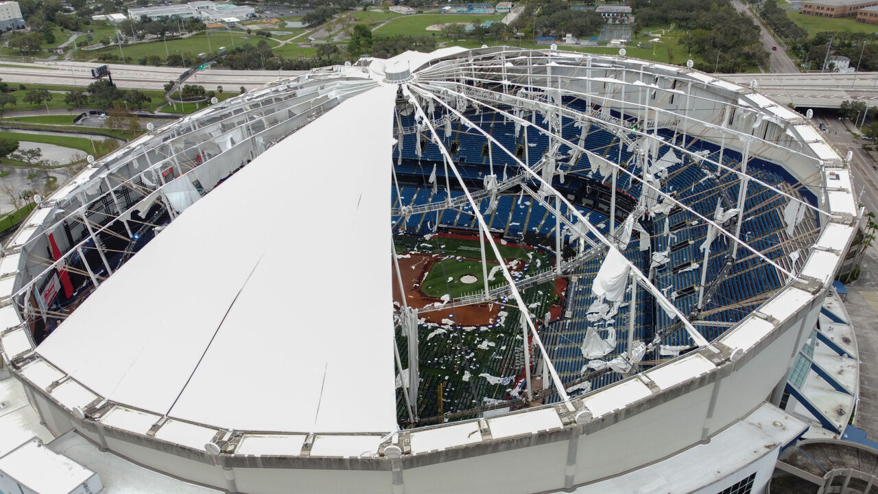 A drone image shows the dome of Tropicana Field which has been torn open due to Hurricane Milton in St. Petersburg, Florida, on October 10, 2024. At least four people were confirmed killed as a result of two tornadoes triggered by Hurricane Milton on the east coast of the US state of Florida, local authorities said Thursday.
