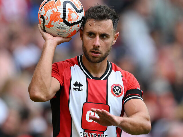 SHEFFIELD, ENGLAND - AUGUST 12: George Baldock of Sheffield United prepares to take a throw-in during the Premier League match between Sheffield United and Crystal Palace at Bramall Lane on August 12, 2023 in Sheffield, England.