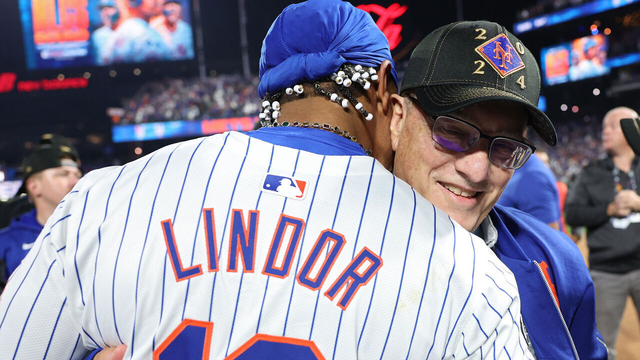 NEW YORK, NEW YORK - OCTOBER 09: Francisco Lindor #12 and owner Steve Cohen of the New York Mets celebrate after beating the Philadelphia Phillies 4-1 in Game Four of the Division Series at Citi Field on October 09, 2024 in New York City.