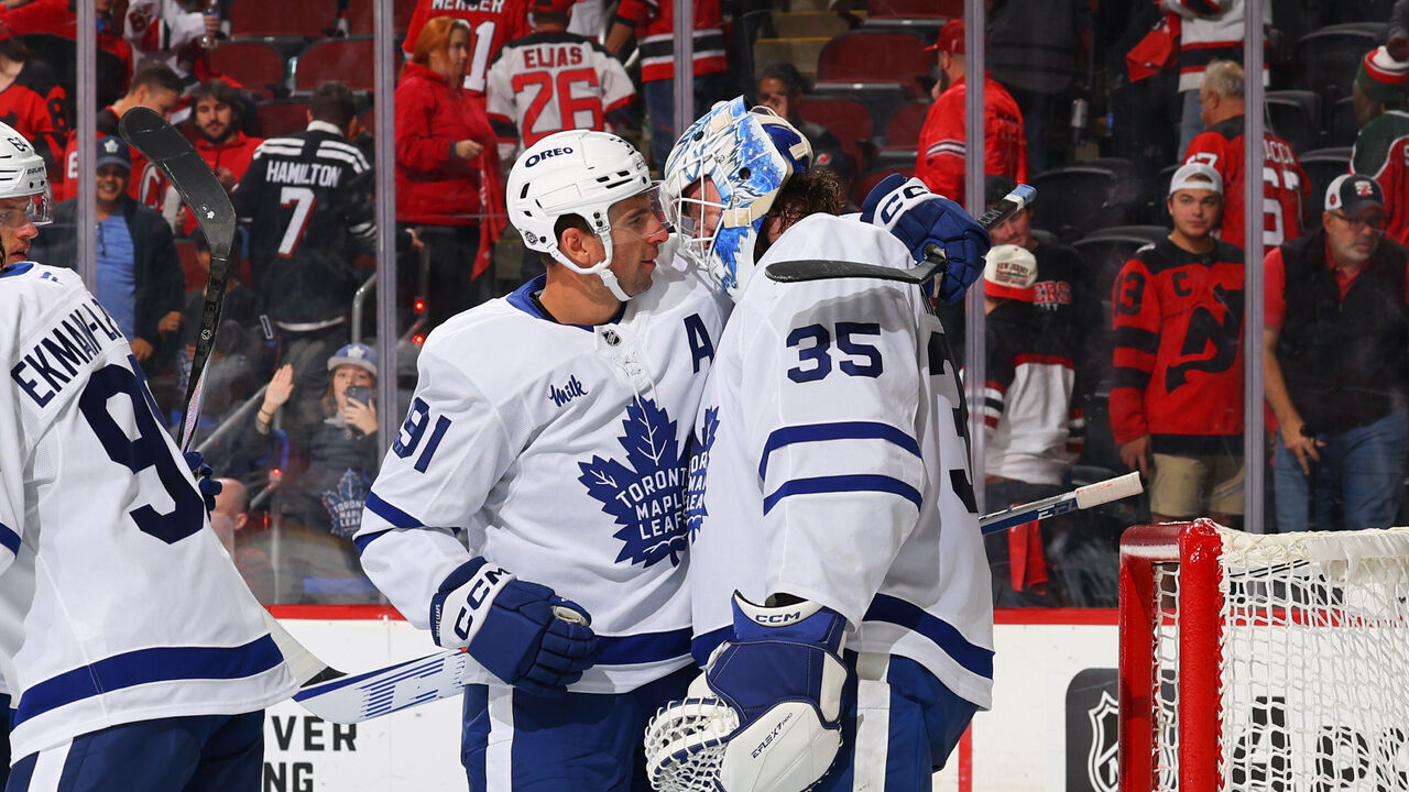 NEWARK, NJ - OCTOBER 10: Dennis Hildeby #35 of the Toronto Maple Leafs celebrates with teammates his first NHL win in the game against the New Jersey Devils at the Prudential Center on October 10, 2024 in Newark, New Jersey.