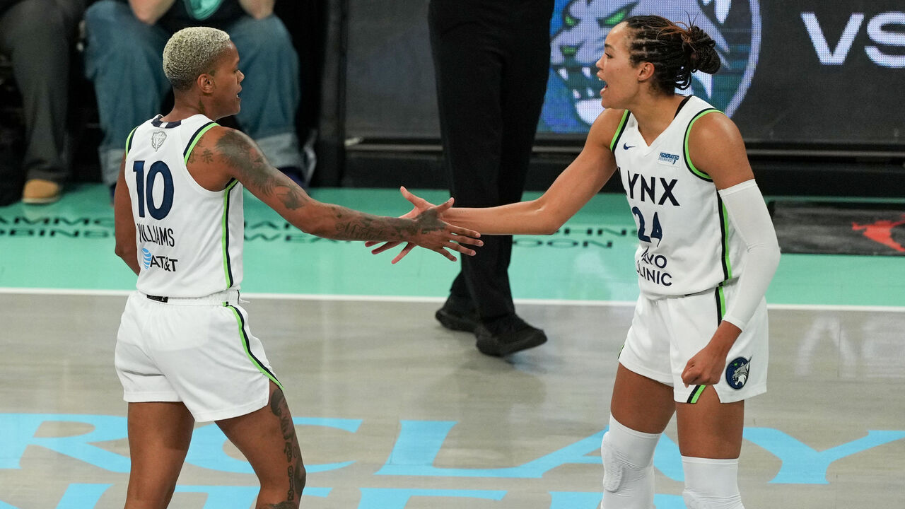 BROOKLYN, NY - OCTOBER 10: Courtney Williams #10 and Napheesa Collier #24 of the Minnesota Lynx high five during the game against the New York Liberty during Game One of the 2024 WNBA Finals on October 10, 2024 at the Barclays Center in Brooklyn, New York. Mandatory Copyright Notice: Copyright 2024 NBAE