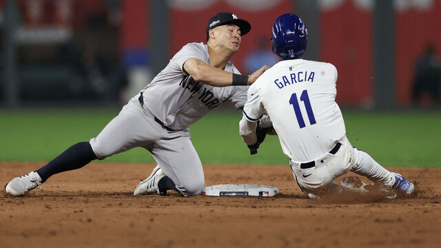 KANSAS CITY, MISSOURI - OCTOBER 10: Anthony Volpe #11 of the New York Yankees tags out Maikel Garcia #11 of the Kansas City Royals during the sixth inning during Game Four of the Division Series at Kauffman Stadium on October 10, 2024 in Kansas City, Missouri.