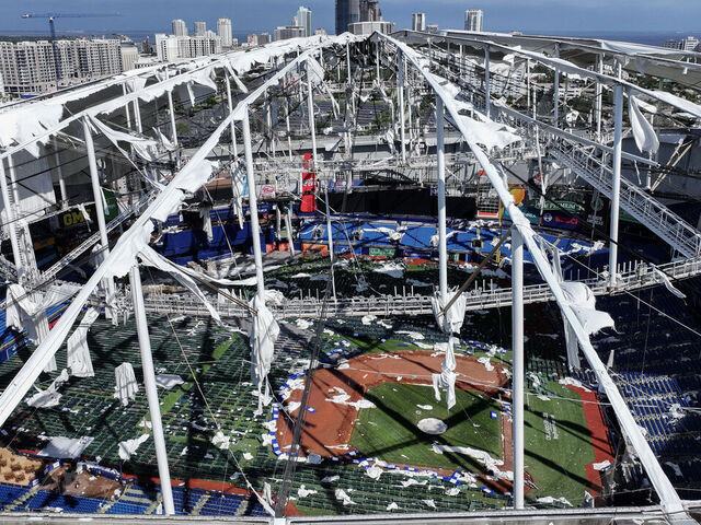 ST PETERSBURG - OCTOBER 10: In this aerial view, the roof of Tropicana Field is seen in tatters after Hurricane Milton destroyed it as the storm passed through the area on October 10, 2024, in St. Petersburg, Florida. The storm made landfall as a Category 3 hurricane in the Siesta Key area of Florida, causing damage and flooding throughout Central Florida.