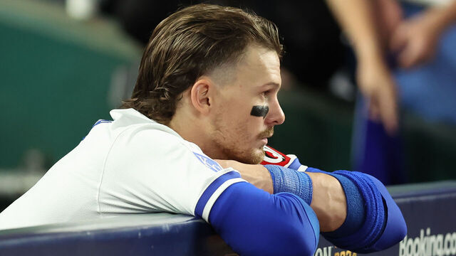 KANSAS CITY, MO - OCTOBER 10: Kansas City Royals shortstop Bobby Witt Jr. (7) leans dejectedly on the dugout wall after losing game 4 of the ALDS between the New York Yankees and Kansas City Royals on October 10, 2024 at Kauffman Stadium in Kansas City, MO.