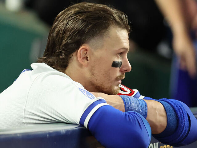 KANSAS CITY, MO - OCTOBER 10: Kansas City Royals shortstop Bobby Witt Jr. (7) leans dejectedly on the dugout wall after losing game 4 of the ALDS between the New York Yankees and Kansas City Royals on October 10, 2024 at Kauffman Stadium in Kansas City, MO.