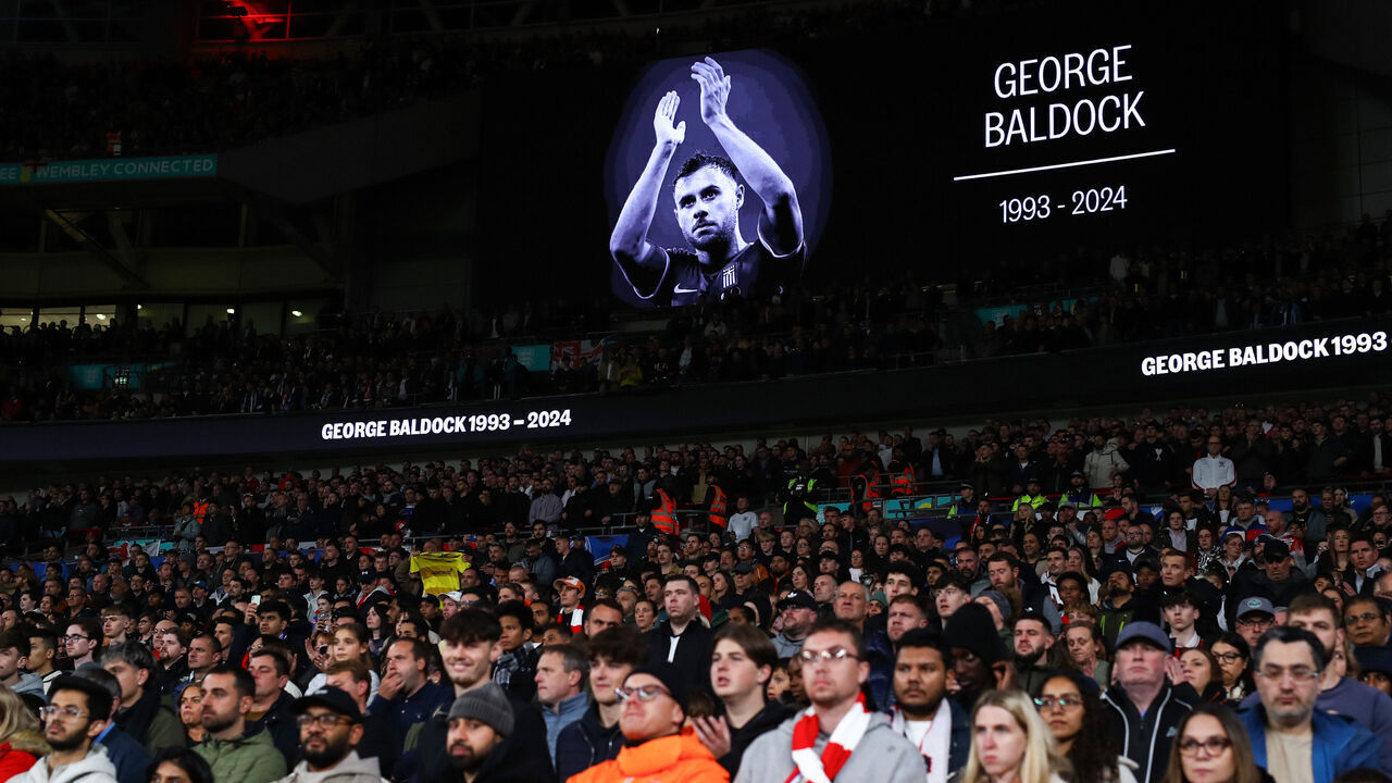 LONDON, ENGLAND - OCTOBER 10: The fans stand for a minute silence in memory of George Baldock during the UEFA Nations League 2024/25 League B Group B2 match between England and Greece at Wembley Stadium on October 10, 2024 in London, England.