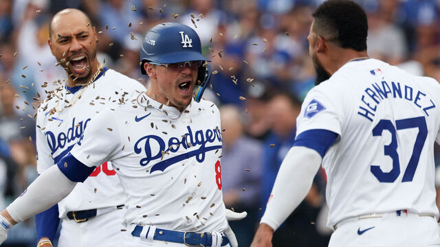 LOS ANGELES, CALIFORNIA - OCTOBER 11: Teoscar Hernandez #37 of the Los Angeles Dodgers celebrates a solo home run by Enrique Hernandez #8 of the Los Angeles Dodgers by throwing sunflower seeds on Enrique during the second inning in game five of the National League Division Series against the San Diego Padres at Dodger Stadium on Friday, Oct. 11, 2024 in Los Angeles. (Robert Gauthier / Los Angeles Times via Getty Images)