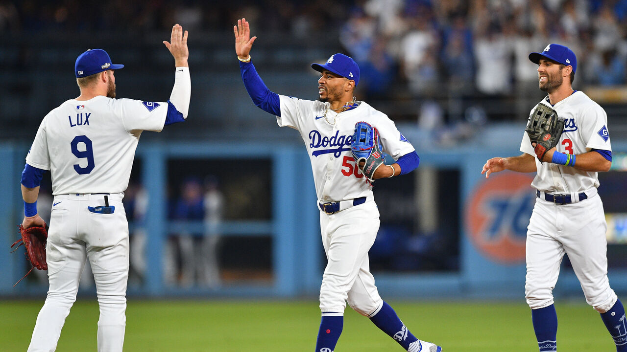 LOS ANGELES, CA - OCTOBER 11: Los Angeles Dodgers shortstop Mookie Betts (50) celebrates with Los Angeles Dodgers second baseman Gavin Lux (9) after the final out of game five of the National League Division Series game between the San Diego Padres and the Los Angeles Dodgers on October 11, 2024 at Dodger Stadium in Los Angeles, CA.