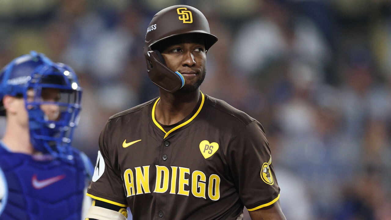 LOS ANGELES, CALIFORNIA - OCTOBER 11: Jurickson Profar #10 of the San Diego Padres reacts after striking out against the Los Angeles Dodgers during the seventh inning of Game Five of the Division Series at Dodger Stadium on October 11, 2024 in Los Angeles, California.