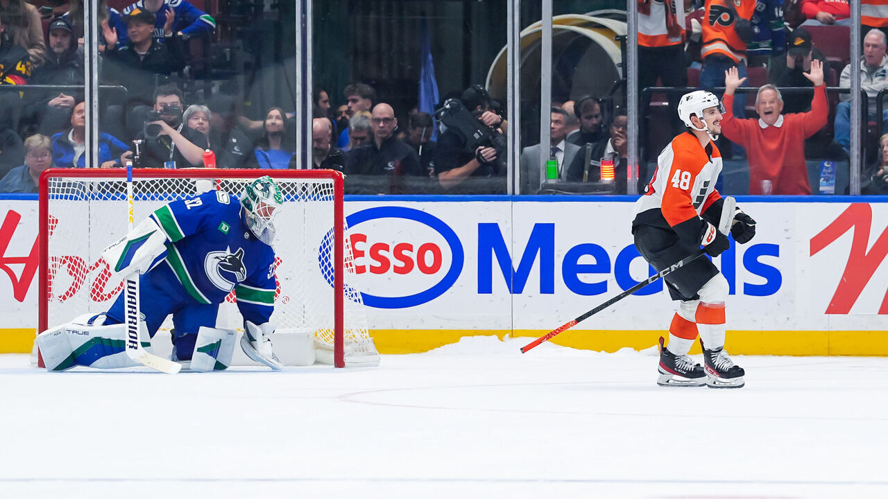 VANCOUVER, CANADA - OCTOBER 11: Morgan Frost #48 of the Philadelphia Flyers celebrates after scoring the game winning goal on Kevin Lankinen #32 of the Vancouver Canucks in the shootout during their NHL game at Rogers Arena on October 11, 2024 in Vancouver, British Columbia, Canada.