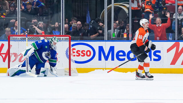 VANCOUVER, CANADA - OCTOBER 11: Morgan Frost #48 of the Philadelphia Flyers celebrates after scoring the game winning goal on Kevin Lankinen #32 of the Vancouver Canucks in the shootout during their NHL game at Rogers Arena on October 11, 2024 in Vancouver, British Columbia, Canada.