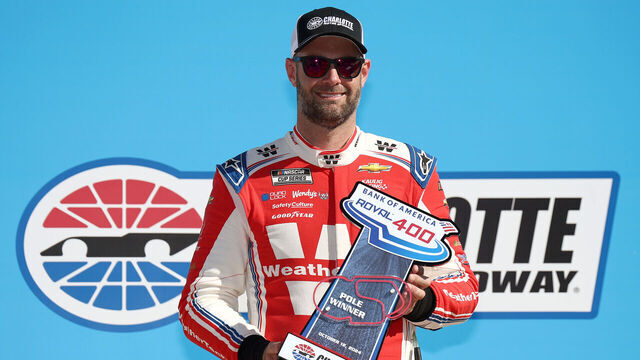CONCORD, NORTH CAROLINA - OCTOBER 12: Shane Van Gisbergen, driver of the #13 WeatherTech Chevrolet, poses for photos with the Bank of America ROVAL 400 Pole Winner trophy after winning the pole award during qualifying for the NASCAR Cup Series Bank of America ROVAL 400 at Charlotte Motor Speedway on October 12, 2024 in Concord, North Carolina.