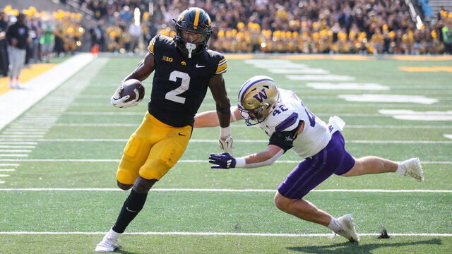 IOWA CITY, IOWA- OCTOBER 12: Running back Kaleb Johnson #2 of the Iowa Hawkeyes runs in a touchdown during the first half against linebacker Carson Bruener #42 of the Washington Huskies at Kinnick Stadium on October 12, 2024 in Iowa City, Iowa.