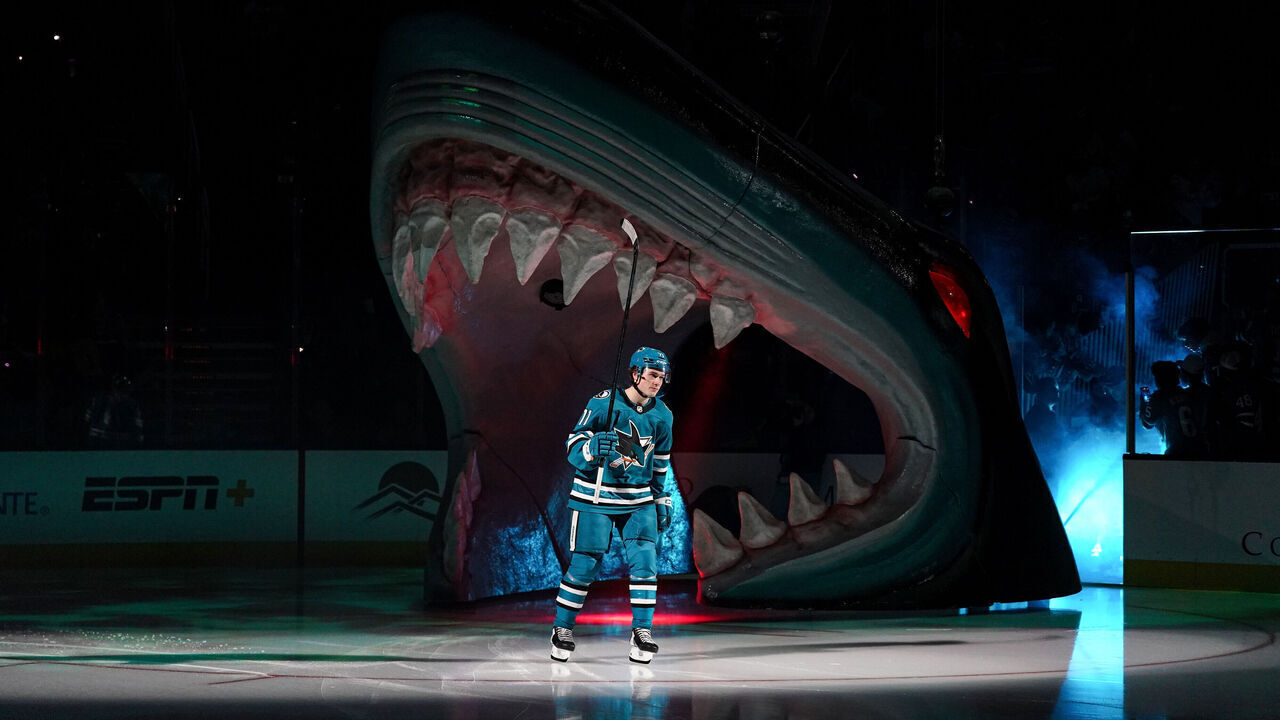 SAN JOSE, CA - OCTOBER 10: Macklin Celebrini #71 of the San Jose Sharks takes the ice through the Shark Head for his NHL Debut against the St. Louis Blues at SAP Center on October 10, 2024 in San Jose, California.