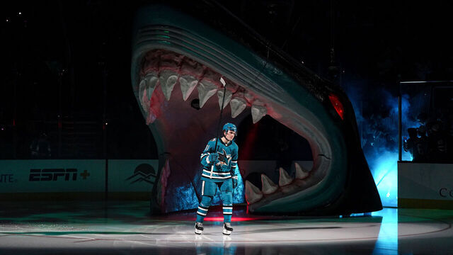 SAN JOSE, CA - OCTOBER 10: Macklin Celebrini #71 of the San Jose Sharks takes the ice through the Shark Head for his NHL Debut against the St. Louis Blues at SAP Center on October 10, 2024 in San Jose, California.