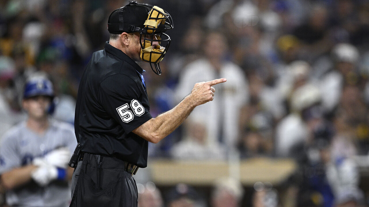 SAN DIEGO, CALIFORNIA - JULY 30: Home plate umpire Dan Iassogna #58 gestures during the eighth inning of the game between the San Diego Padres and the Los Angeles Dodgers at Petco Park on July 30, 2024 in San Diego, California.