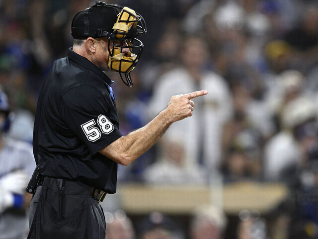 SAN DIEGO, CALIFORNIA - JULY 30: Home plate umpire Dan Iassogna #58 gestures during the eighth inning of the game between the San Diego Padres and the Los Angeles Dodgers at Petco Park on July 30, 2024 in San Diego, California.