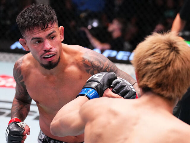 LAS VEGAS, NEVADA - OCTOBER 12: (L-R) Brandon Royval punches Tatsuro Taira of Japan in a flyweight fight during the UFC Fight Night event at UFC APEX on October 12, 2024 in Las Vegas, Nevada.