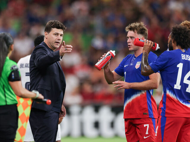 AUSTIN, TEXAS - OCTOBER 12: United States head coach Mauricio Pochettino talks with Aidan Morris #7 and Gianluca Busio #14 during the second half against p at Q2 Stadium on October 12, 2024 in Austin, Texas.
