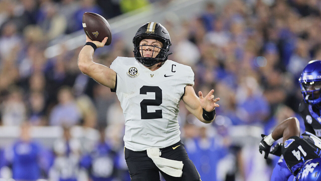 LEXINGTON, KENTUCKY - OCTOBER 12: Diego Pavia #2 of the Vanderbilt Commodores throws a touchdown pass against the Kentucky Wildcats at Kroger Field on October 12, 2024 in Lexington, Kentucky.