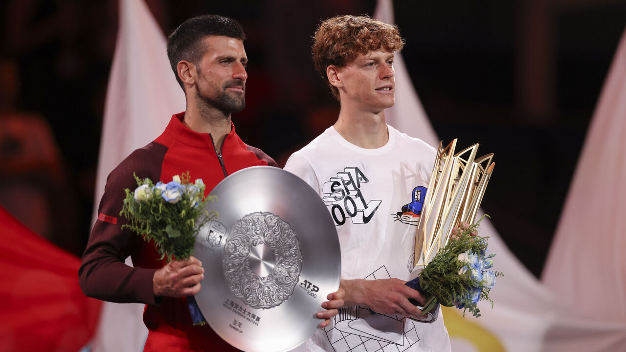 SHANGHAI, CHINA - OCTOBER 13: Jannik Sinner (R) of Italy and Novak Djokovic of Serbia pose with the trophy during the award ceremony after Men's Singles final match on Day 14 of 2024 Shanghai Rolex Masters at Qi Zhong Tennis Centre on October 13, 2024 in Shanghai, China.