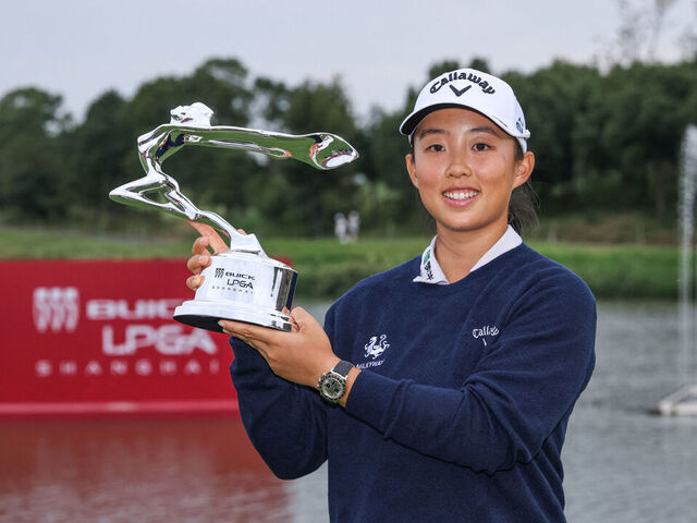 Yin Ruoning of China poses with the trophy after winning the Shanghai LPGA golf tournament in Shanghai on October 13, 2024.