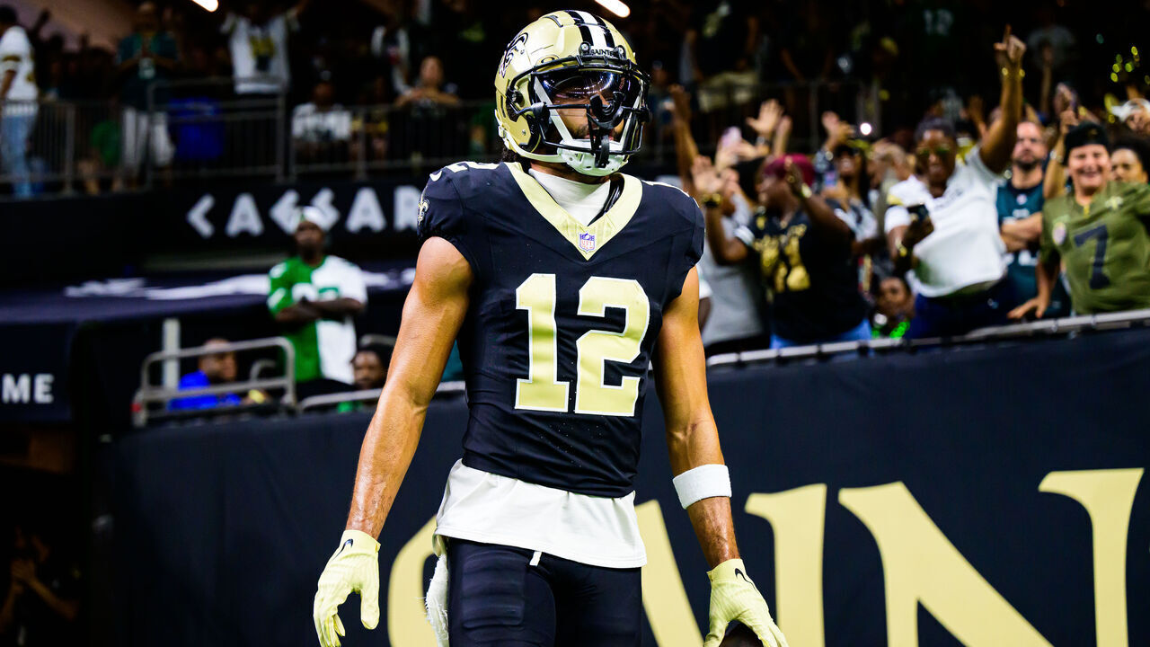 NEW ORLEANS, LOUISIANA - SEPTEMBER 22: Chris Olave #12 of the New Orleans Saints celebrates a touchdown reception against the Philadelphia Eagles during the fourth quarter at Caesars Superdome on September 22, 2024 in New Orleans, Louisiana.