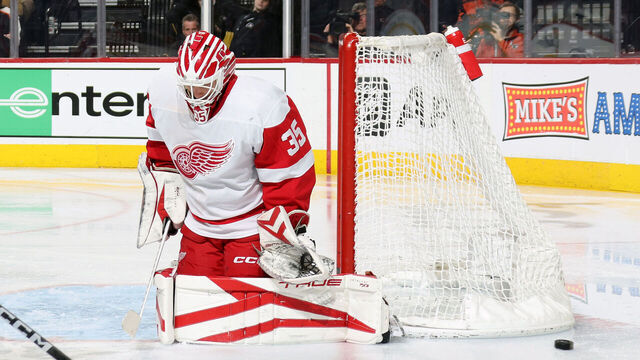 PHILADELPHIA, PENNSYLVANIA - DECEMBER 16: Ville Husso #35 of the Detroit Red Wings deflects a shot on goal by the Philadelphia Flyers at the Wells Fargo Center on December 16, 2023 in Philadelphia, Pennsylvania.