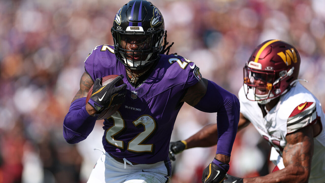 BALTIMORE, MARYLAND - OCTOBER 13: Derrick Henry #22 of the Baltimore Ravens carries the ball for a touchdown against the Washington Commanders during the second quarter at M&T Bank Stadium on October 13, 2024 in Baltimore, Maryland.