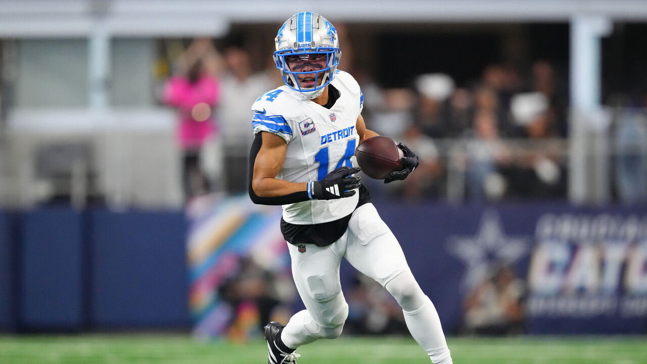 ARLINGTON, TEXAS - OCTOBER 13: Amon-Ra St. Brown #14 of the Detroit Lions runs the ball up the field in the second quarter of a game against the Dallas Cowboys at AT&T Stadium on October 13, 2024 in Arlington, Texas.