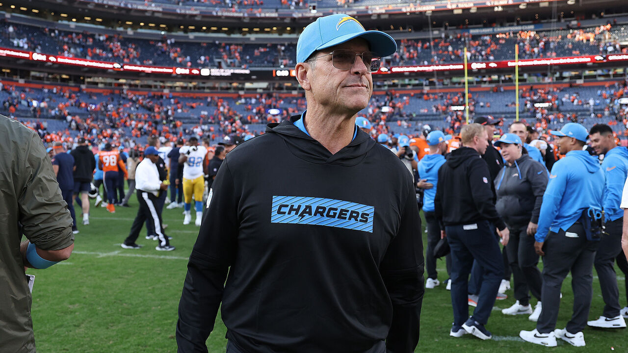 DENVER, COLORADO - OCTOBER 13: Head coach Jim Harbaugh of the Los Angeles Chargers on the field following their 23-16 win against the Denver Broncos at Empower Field At Mile High on October 13, 2024 in Denver, Colorado.
