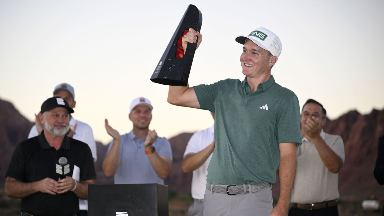 ST GEORGE, UTAH - OCTOBER 13: Matt McCarty of the United States celebrates with the trophy after winning the final round of the Black Desert Championship 2024 at Black Desert Resort on October 13, 2024 in St George, Utah.