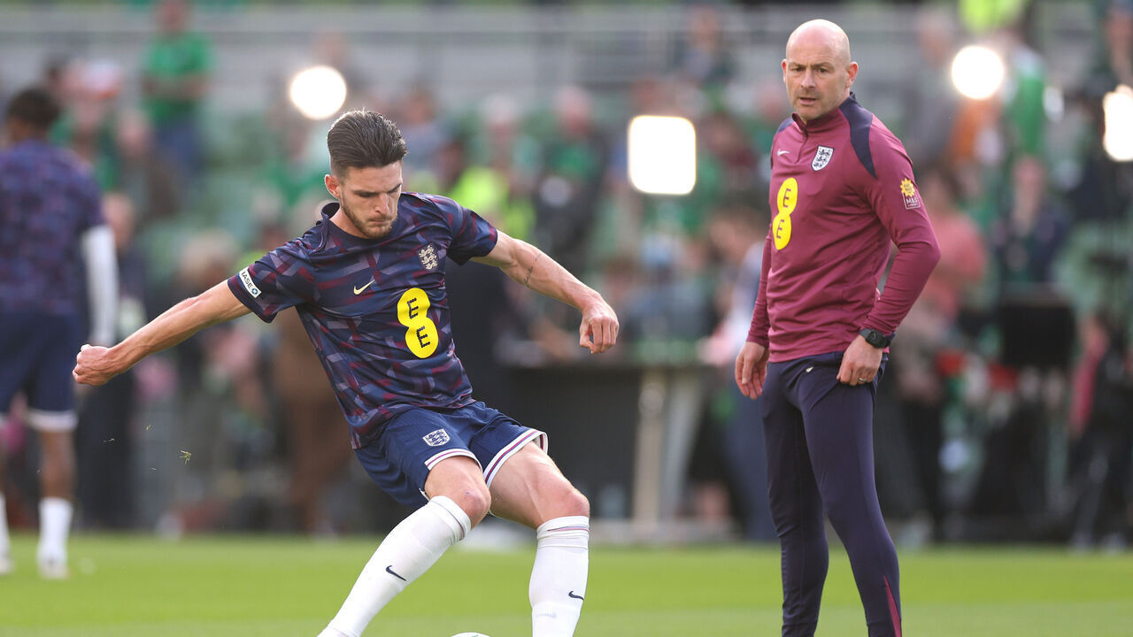 DUBLIN, IRELAND - SEPTEMBER 07: Declan Rice of England shoots during the warm up, as Lee Carsley, Interim Head Coach of England looks on prior to the UEFA Nations League 2024/25 League B Group B2 match between Republic of Ireland and England at Aviva Stadium on September 07, 2024 in Dublin, Ireland.