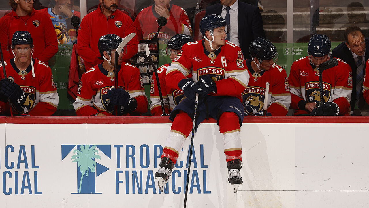 SUNRISE, FLORIDA - OCTOBER 8: Matthew Tkachuk #19 of the Florida Panthers sits on the boards during a break in the action against the Boston Bruins at the Amerant Bank Arena on October 8, 2024 in Sunrise, Florida.