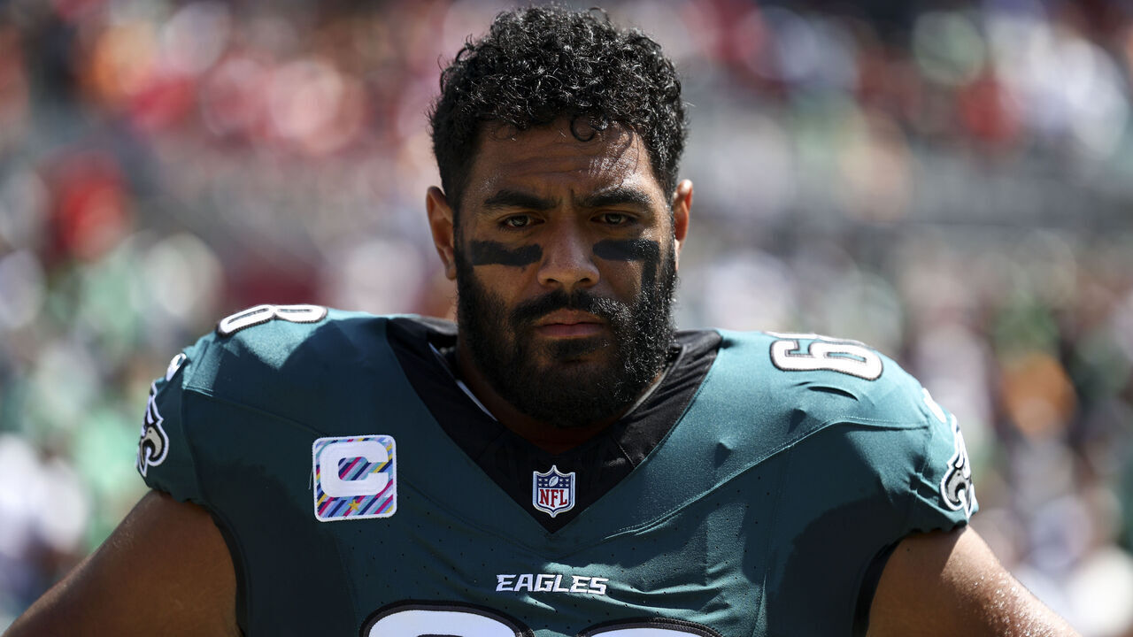 TAMPA, FL - SEPTEMBER 29: Jordan Mailata #68 of the Philadelphia Eagles stands on the sidelines during the national anthem prior to an NFL football game against the Tampa Bay Buccaneers at Raymond James Stadium on September 29, 2024 in Tampa, Florida.