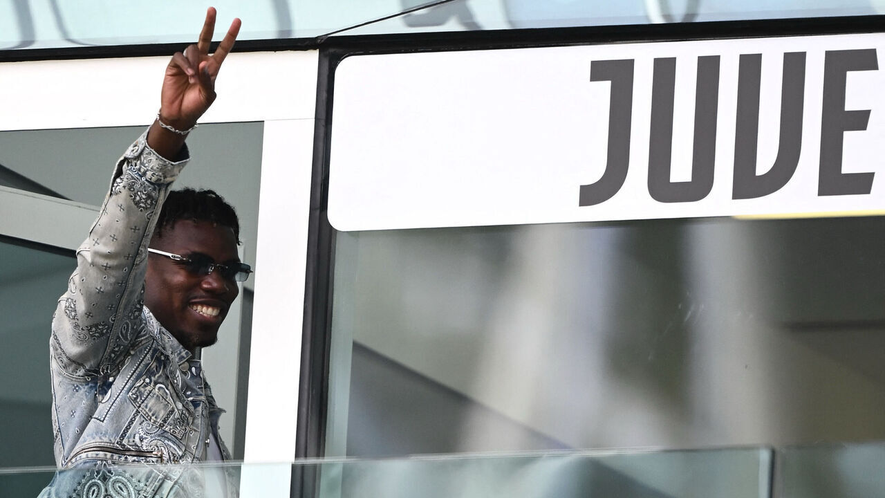 TOPSHOT - French forward Paul Pogba waves as he arrives to attend the Italian Serie A football match between Juventus and Cagliari at the Allianz stadium in Turin, on October 6, 2024.