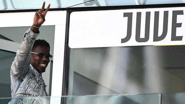 TOPSHOT - French forward Paul Pogba waves as he arrives to attend the Italian Serie A football match between Juventus and Cagliari at the Allianz stadium in Turin, on October 6, 2024.